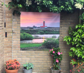 Tuinposter, vuurtoren tijdens zonsondergang.