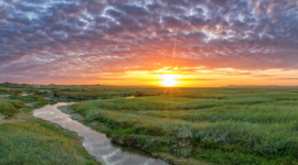 De Slufter tijdens zonsondergang, ringen in de hoeken.