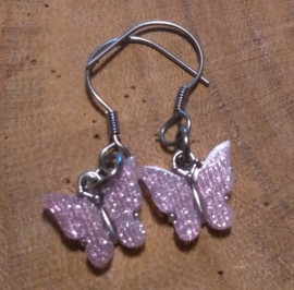 Vlinder glitter roze met zilverkleurige hanger  (O112)