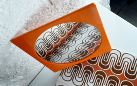 Jaren 70 wandspiegel, kunstof oranje spiegel