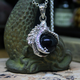 Dragonclaw necklace holding a black Agate