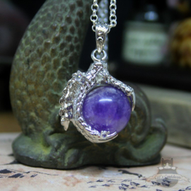 Dragonclaw necklace holding an Amethyst