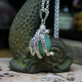 Dragonclaw necklace holding an Aventurine