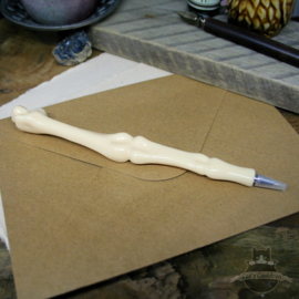 Ballpoint pen in the shape of multiple bones