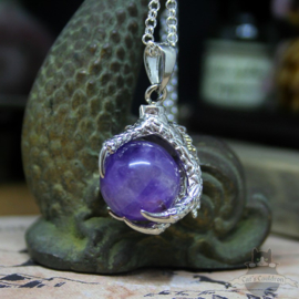 Dragonclaw necklace holding an Amethyst