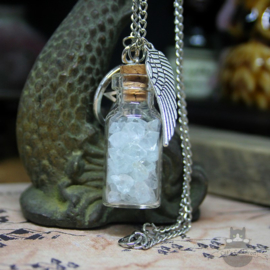Bottle with crystals and pentagram necklace
