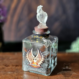 Phoenix Ashes with feathers in jar