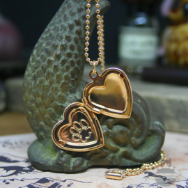 Valtentine heart shaped locket with cat pawprint gold colored