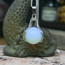 Spiritual necklace of two hands holding an Opal sphere