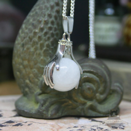 Spiritual necklace of two hands holding a Rock Crystal sphere