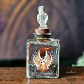 Phoenix Ashes with feathers in jar