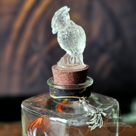 Phoenix Ashes with feathers in jar