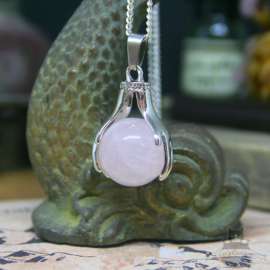 Spiritual necklace of two hands holding a Rose Quartz sphere