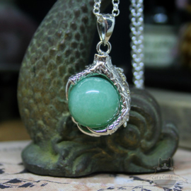 Dragonclaw necklace holding an Aventurine