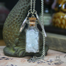 Bottle with crystals and pentagram necklace