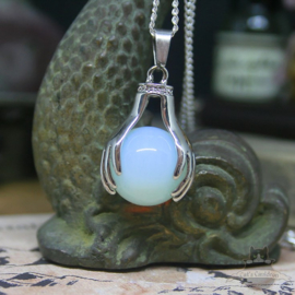 Spiritual necklace of two hands holding an Opal sphere