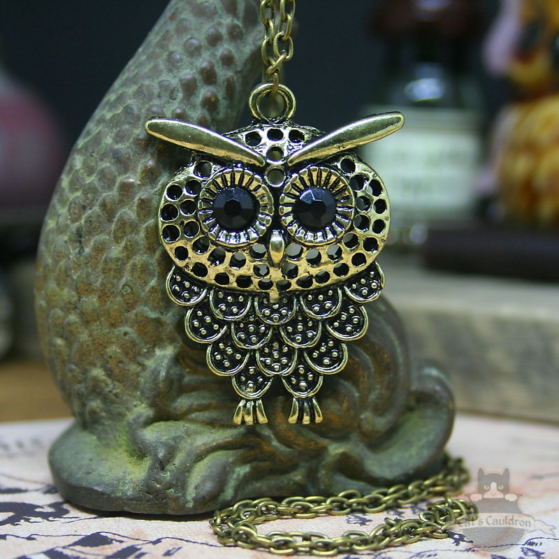 Owl necklace with dark eyes bronze colored