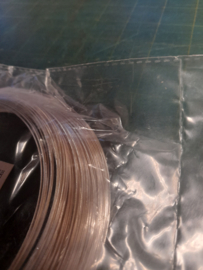 OPRUIMING - 250 gram memory wire/ spiraaldraad 0.6 mm.  11 cm. diameter
