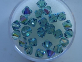 109106/1140- 25 x swarovski 6mm erinite green met AB coating