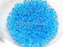 Opr. van CRP11/63  12 gram Preciosa Rocailles 11/0 Transparant Blauwe kern