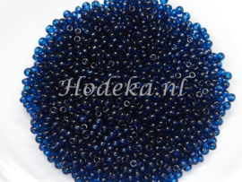 CRP15/16a  50 gram Preciosa Rocailles 15/0 Donker Blauw transparant