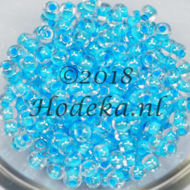 CRP06/47  12 gram Preciosa Rocailles 6/0  transparant blauwe kern