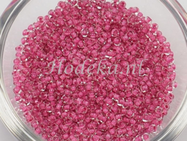 CRP10/61a  50 gram Preciosa Rocailles 10/0 Transparant roze kern