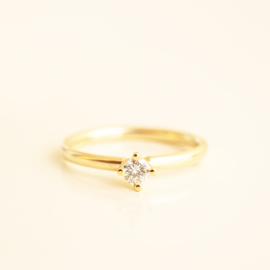 round four solitaire ring