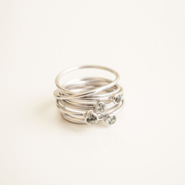 round swirl ring with stackers in white gold