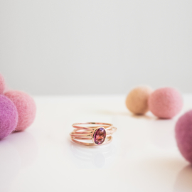 half round rose gold swirl ring with tourmaline