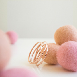 half round rose gold swirl ring with tourmaline