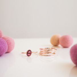 half round rose gold swirl ring with tourmaline