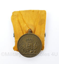 Defensie trouwe dienst voor 12 jaar trouwe dienst medaille uit periode  Koningin Juliana - origineel