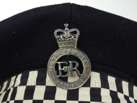 Britse metropolitan police pet met insigne - maat 56 of 59 cm.  - origineel