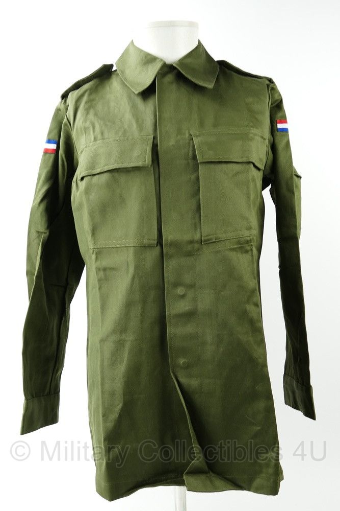 KL M78 uniform jas uit 1981 met vlaggetje op rechterschouder verkeerd om - maat 92 - nieuwstaat - origineel