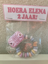 ZAKJE MET SNOEP HORLOGE MET LABEL  MET TEKST