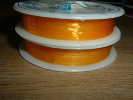 Elastisch nylondraad oranjegeel 0.6 mm.