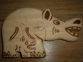 Mooie handgemaakte blank houten puzzle van een nijlpaard uit Burkina Faso