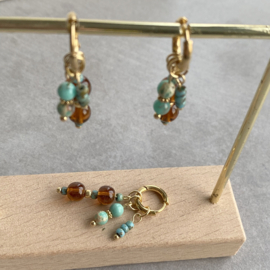 Idhuna Rvs Oorringen met Bedels Goud Kralen hangers Bruin en turquoise