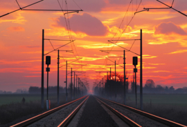 Papermoon Fotobehang Treinrails Met Zonsondergang