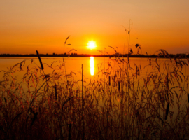 Papermoon Fotobehang Oranje Meer Bij Zonsondergang