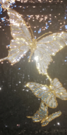 Prachtig dubbelzijdig glitterjurkje zilveren vlinders met gouden randjes maat 36/38