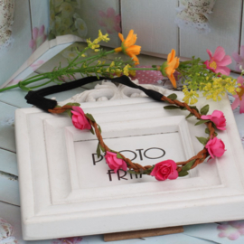 Leuke elastieken haarband met fuchsia roosjes
