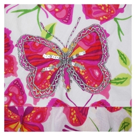 Geweldig wit puntenjurkje met glitters en muntjes roze vlinder