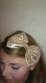 Leuke haarband met grote glitterstrik goud