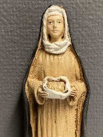 Heiligenbeeld  Clara van Assisi met brood.