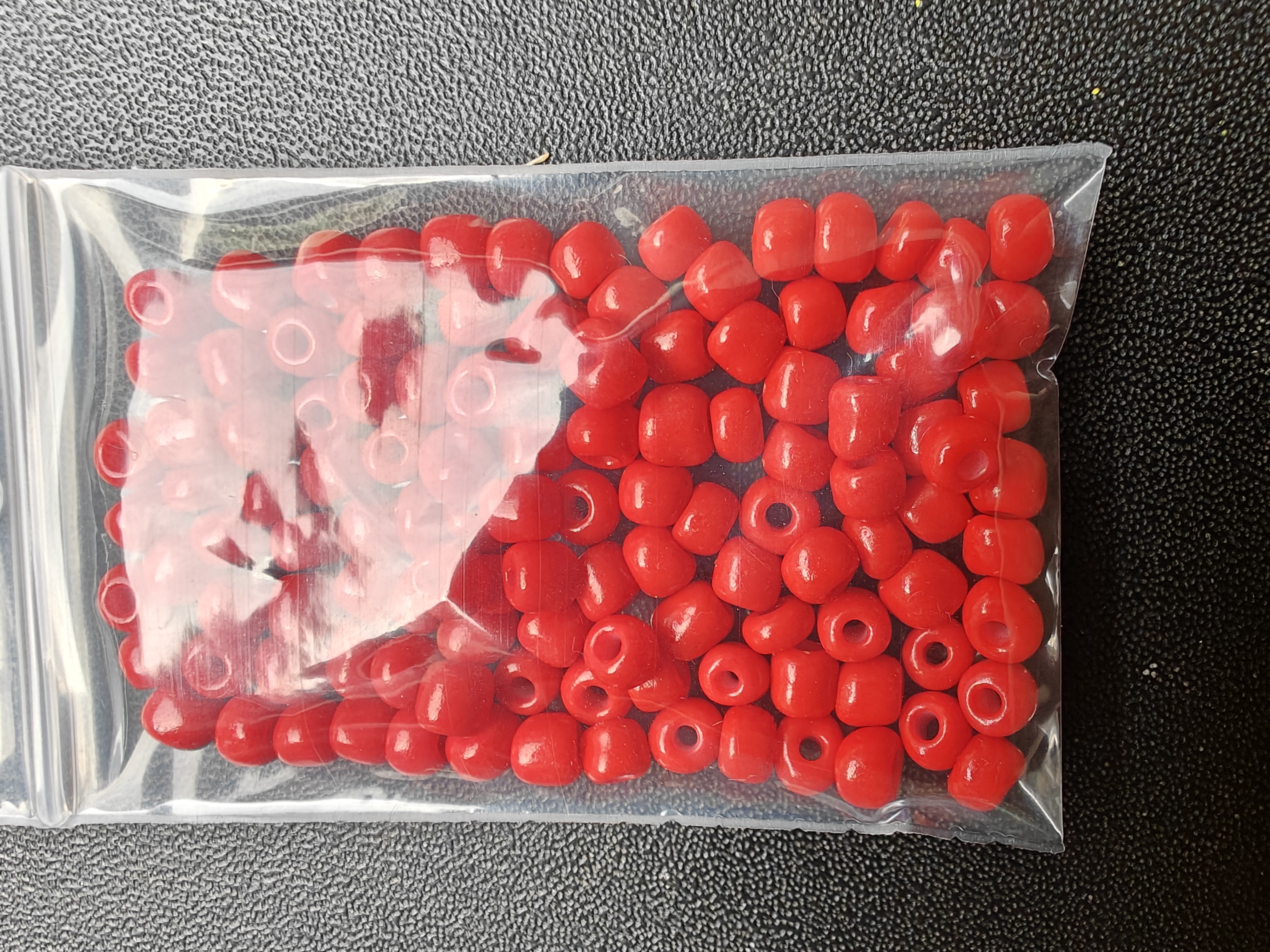 Grote rocailles ongelijk - felrood 10 gram
