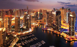 Fotobehang Dubai City Marina bij avond
