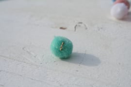 Pompom bedel mint met oog zilver