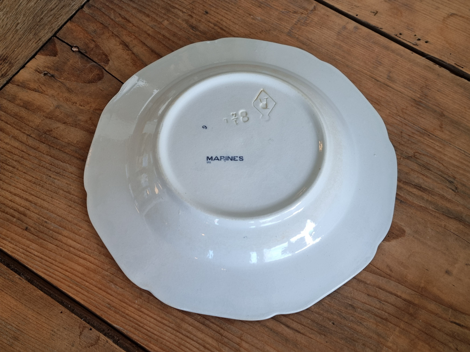Verkocht = Petrus Regout Marines donkerblauw diep bord 23,5 cm (hoekig model, ster)